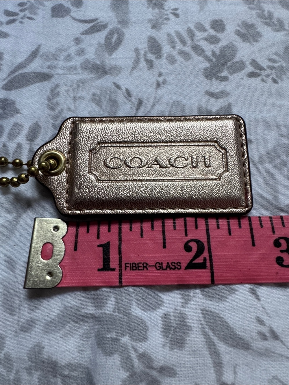 Coach Metallic Rose Gold hangtag